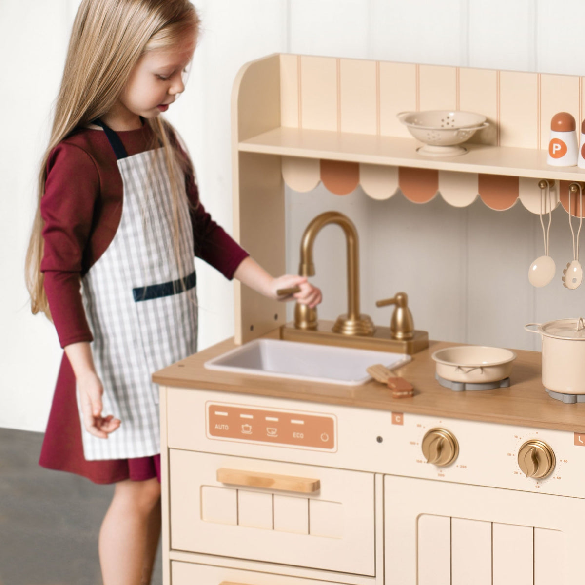 Robud wooden play kitchen rear angle revealing full height cabinet and cooking surface layout.