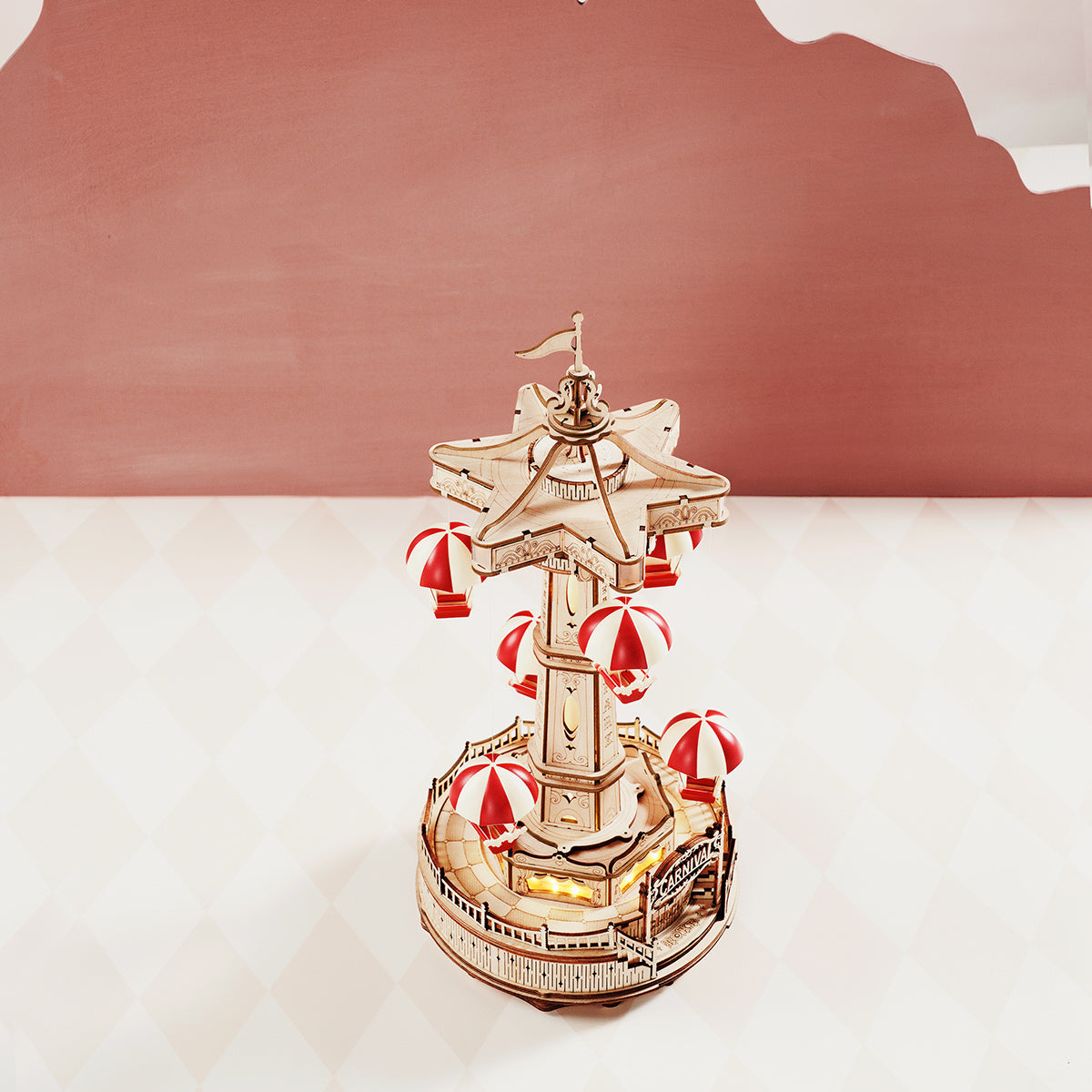 ROKR Parachute Tower carousel model with six red and white striped parachutes against a warm terracotta studio wall