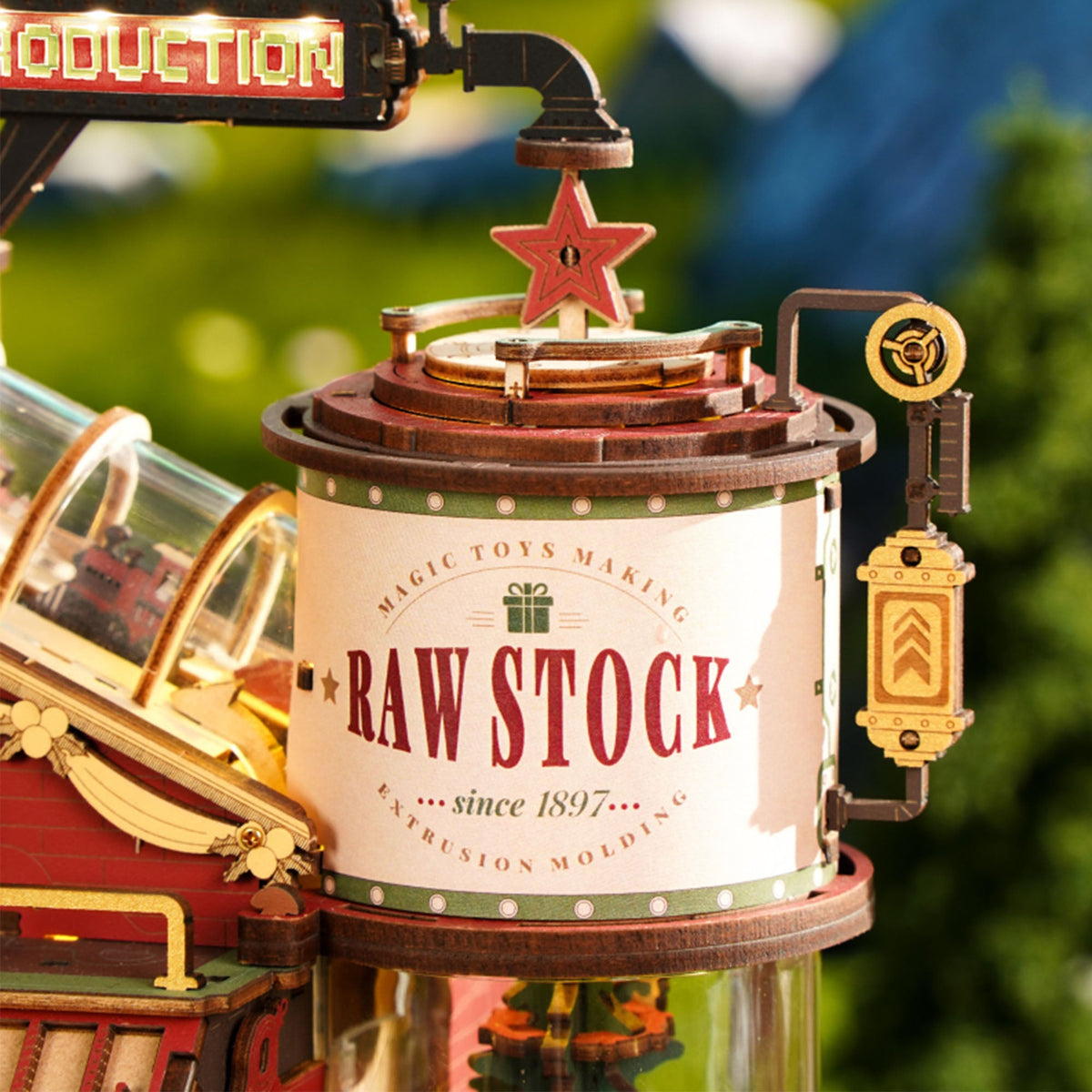 ROKR Dream Gift Factory EAB01 wooden music box upper signage close-up showing Raw Stock cylindrical tower and star detail on red facade