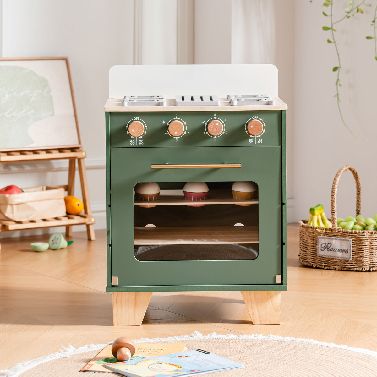 ROBUD vintage green wooden play oven standing in a bright playroom with realistic stovetop burners and copper-tone knobs