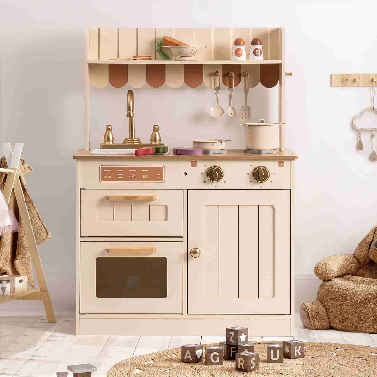 Robud kids kitchen playset with open cabinet doors showing interior storage and play accessories.