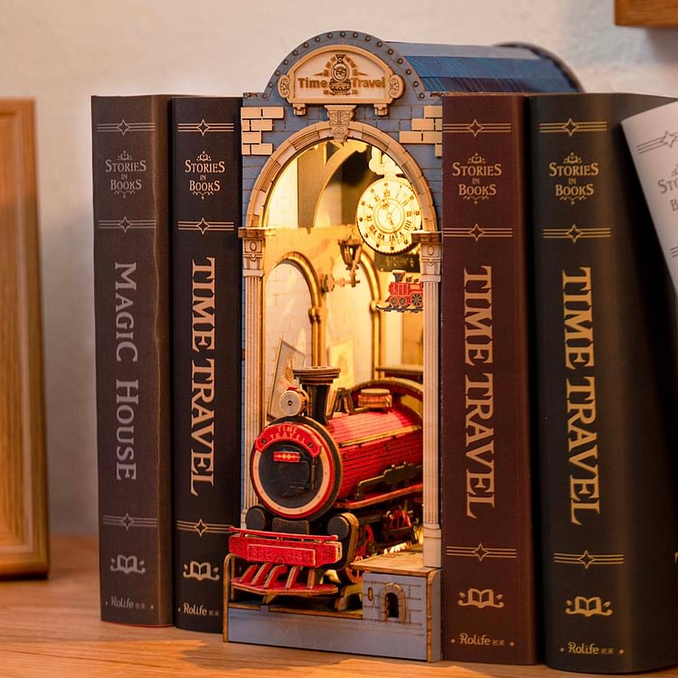 Rolife Time Travel book nook with a glowing red steam train inside a stone arch, flanked by dark spine books