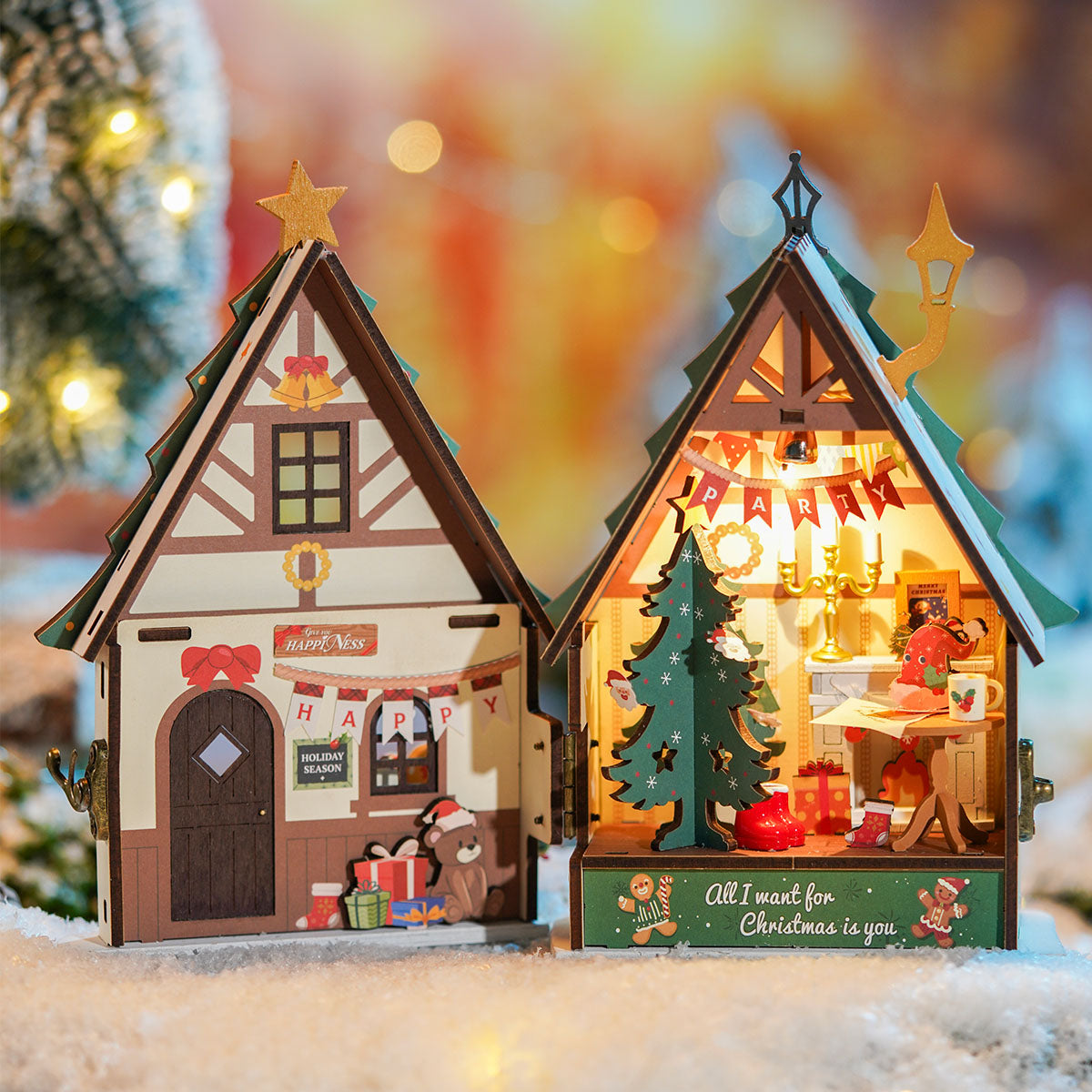 Rolife Twinkling Christmas House DS036 lit exterior placed outdoors with warm amber glow through windows on snowy night